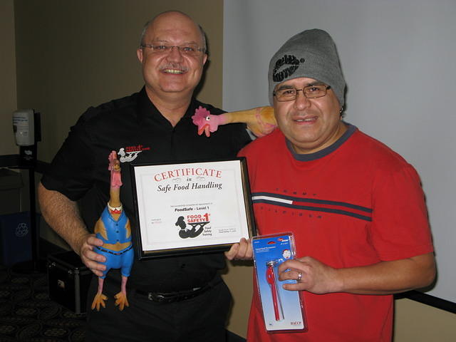 Food Safety 1st, Russell Scott presents Israel Solís of Delta Regina the 5,000th Food Safety 1st certificate!