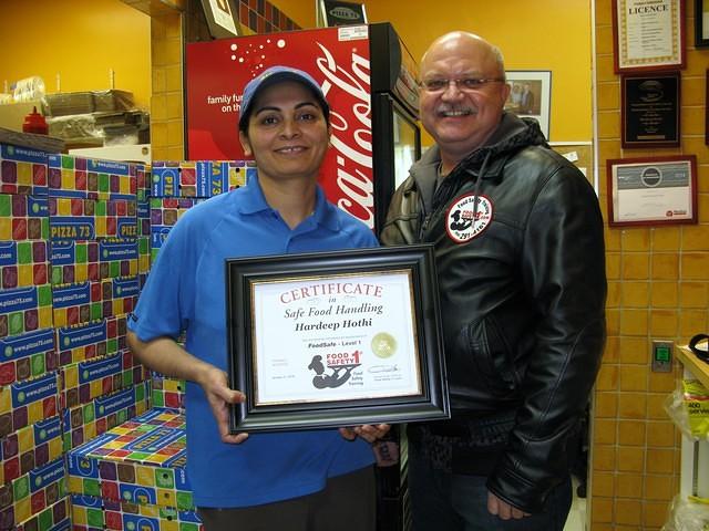 Food Safety 1st, Russell Scott presents Hardeep Hothi of Pizza 73 8th St, Saskatoon the 6,000th Food Safety 1st certificate!