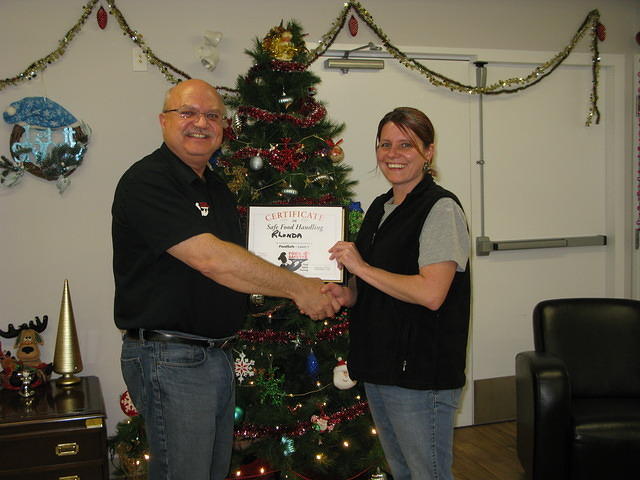 Food Safety 1st, Russell Scott presents Rhonda Gardiner of Cheshire Homes of Saskatoon the 7,000th Food Safety 1st certificate!