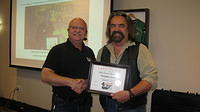 Food Safety 1st, Russell Scott presents Douglas Terry from Melfort Sask. the 9,000th Food Safety 1st certificate!
