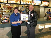 Food Safety 1st, Russell Scott presents Tracy Voth of McDonald's the 1000th Food Safety 1st Certificate!