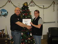 Food Safety 1st, Russell Scott presents Rhonda Gardiner of Cheshire Homes of Saskatoon the 7,000th Food Safety 1st certificate!