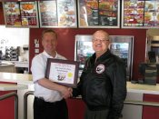 Russell Scott presents Keith Disney of El-Rancho Food Group, KFC the 2000th Food Safety 1st certificate.
