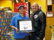 Russell Scott presents Hardeep Hothi of Pizza 73 - 8th Street, Saskatoon the 6,000th Food Safety 1st certificate.